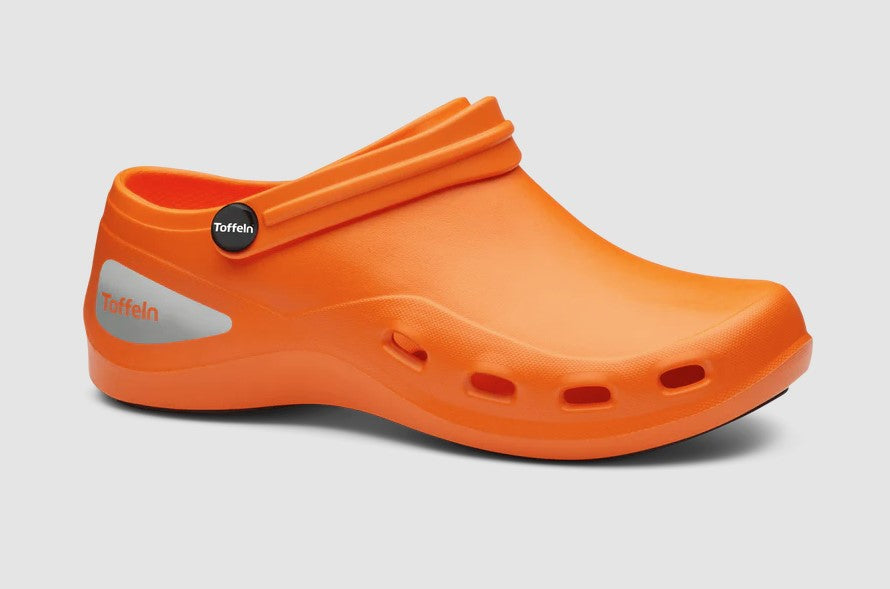 Orange clog shoe with a brand logo on a light gray background